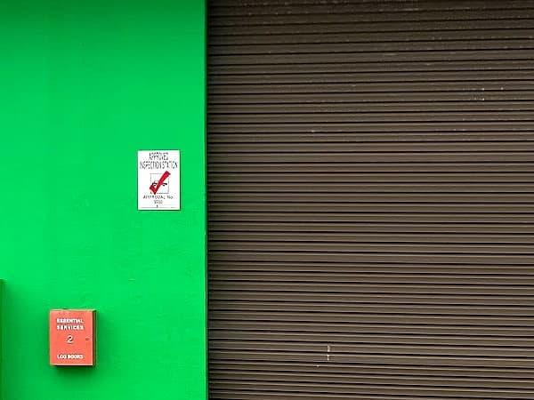 The Approved Inspection Station placard on the wall at AGRADE AUTO, Nerang